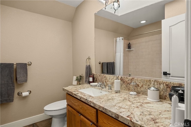 bathroom with toilet, lofted ceiling, vanity, and a shower with shower curtain