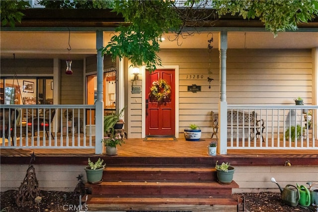 view of exterior entry featuring a porch