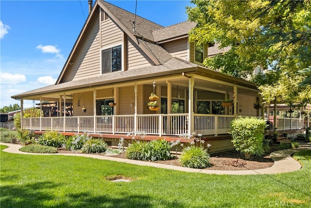 farmhouse featuring a front yard and covered porch