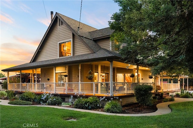 view of front of house featuring a yard and a porch