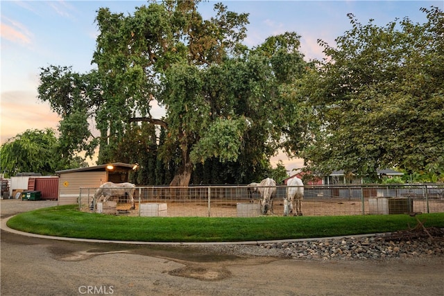 view of yard at dusk