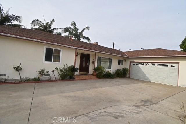 ranch-style house featuring a garage