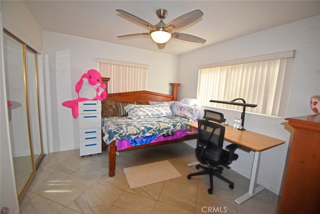 bedroom featuring a closet and ceiling fan