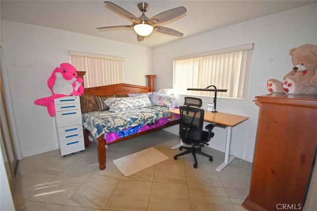 bedroom with ceiling fan and light tile patterned floors