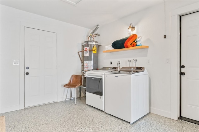 laundry area with water heater and separate washer and dryer