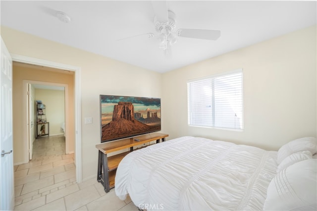 bedroom with light tile patterned floors and ceiling fan