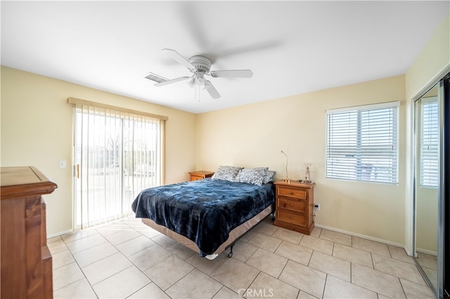 bedroom featuring ceiling fan, access to outside, and light tile patterned floors