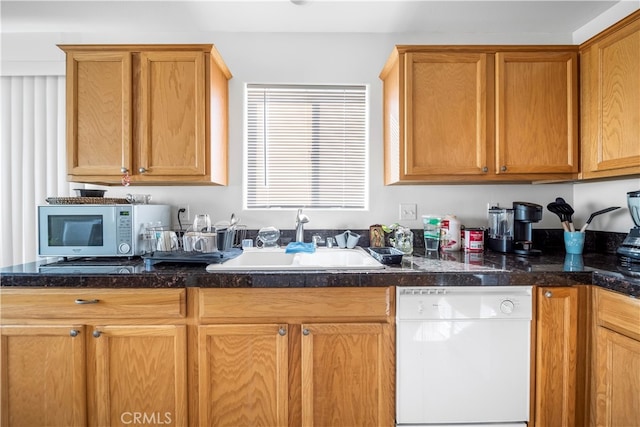 kitchen with sink and white appliances