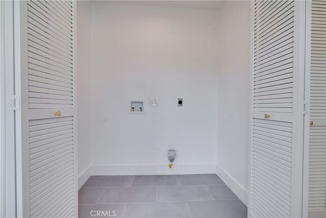 laundry room featuring washer hookup, tile patterned floors, and electric dryer hookup