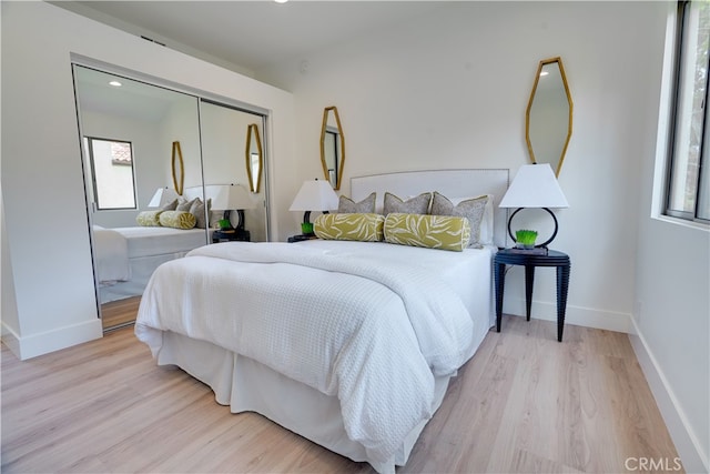 bedroom featuring a closet and light hardwood / wood-style floors