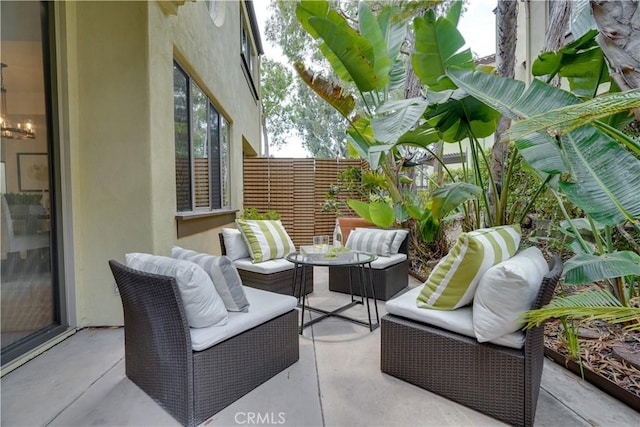 view of patio with fence and outdoor lounge area
