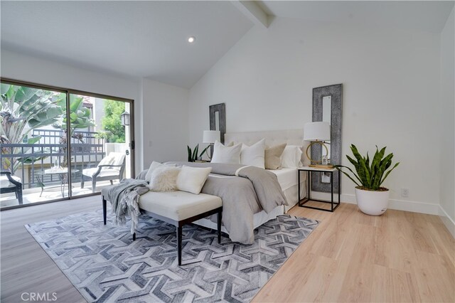 bedroom featuring high vaulted ceiling, beam ceiling, light hardwood / wood-style flooring, and access to outside