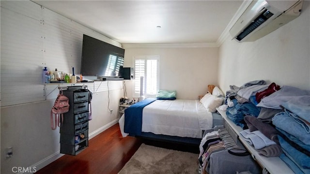 2021 Miramar St, Los Angeles, CA 90057 - bedroom with crown molding, baseboards, dark wood-style floors, and a wall mounted air conditioner