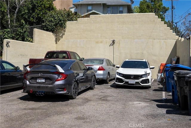uncovered parking lot with fence
