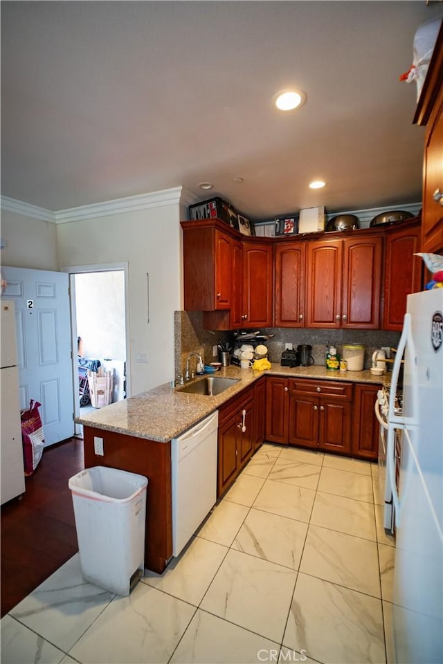 kitchen with white appliances, ornamental molding, a sink, and marble finish floor