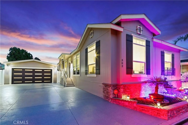 property exterior at dusk with a garage