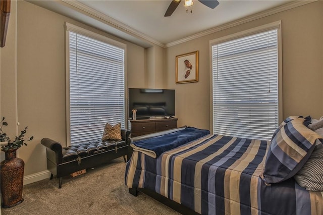 carpeted bedroom featuring ceiling fan and crown molding