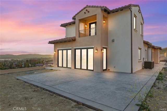 20487 Gartel Dr, Walnut, CA 91789 - rear view of property featuring a balcony, a garage, a patio area, and stucco siding