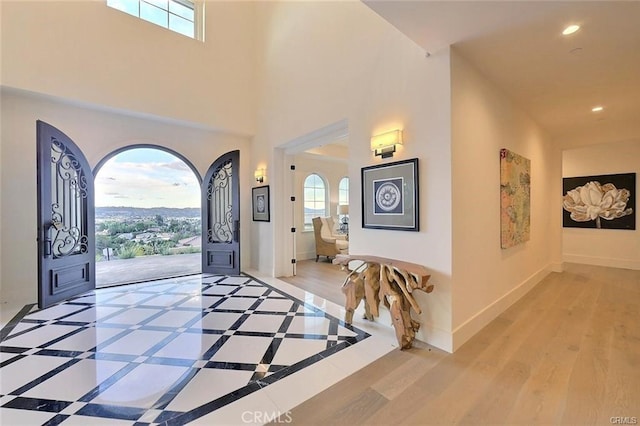 20487 Gartel Dr, Walnut, CA 91789 - entrance foyer featuring recessed lighting, baseboards, wood finished floors, and a high ceiling