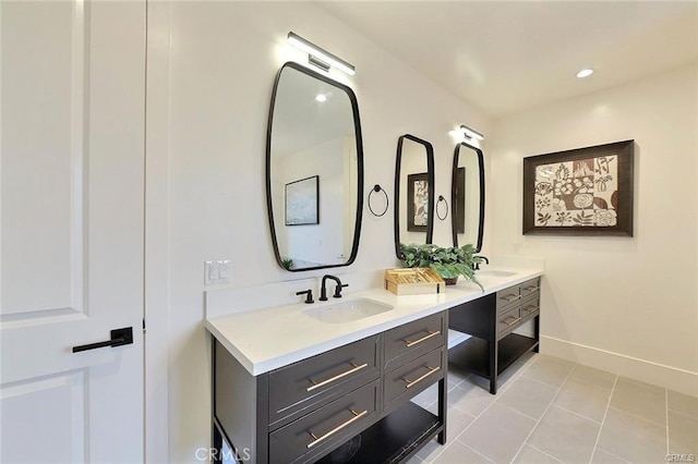 20487 Gartel Dr, Walnut, CA 91789 - bathroom featuring double vanity, tile patterned floors, and baseboards