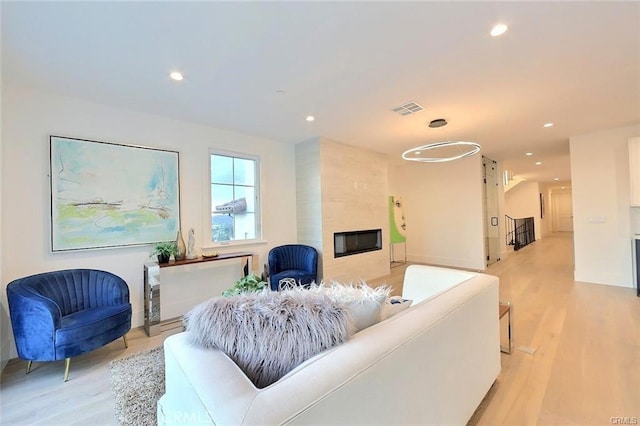 20487 Gartel Dr, Walnut, CA 91789 - living area featuring light wood-style flooring, recessed lighting, and a fireplace