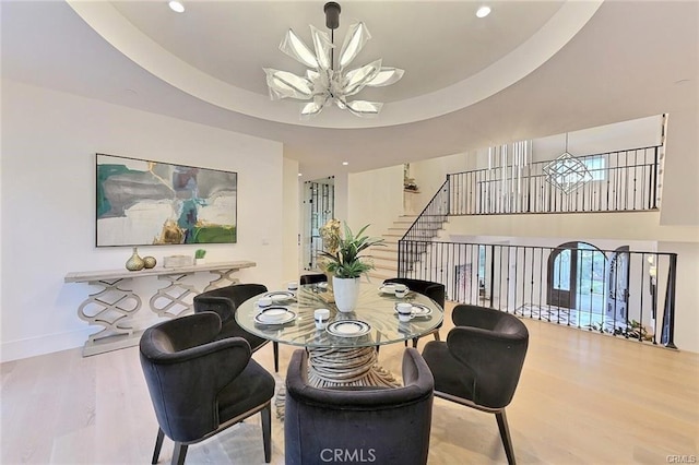 20487 Gartel Dr, Walnut, CA 91789 - dining area featuring a chandelier, wood finished floors, baseboards, recessed lighting, and a towering ceiling
