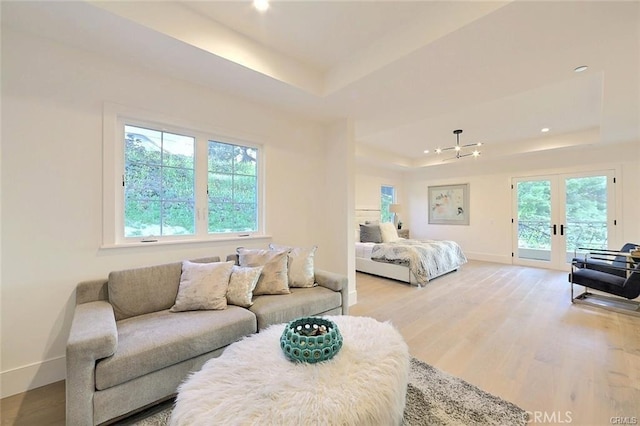20487 Gartel Dr, Walnut, CA 91789 - living area with a tray ceiling, french doors, baseboards, light wood finished floors, and recessed lighting
