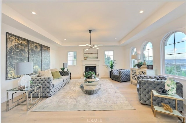20487 Gartel Dr, Walnut, CA 91789 - living room featuring a tray ceiling, wood finished floors, a fireplace, recessed lighting, and ceiling fan