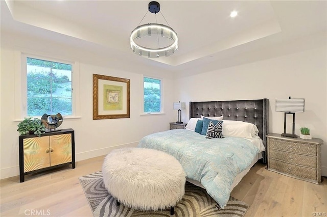 20487 Gartel Dr, Walnut, CA 91789 - bedroom featuring a tray ceiling, wood finished floors, baseboards, and recessed lighting