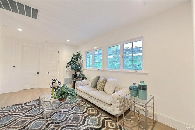 20487 Gartel Dr, Walnut, CA 91789 - living area with wood finished floors, baseboards, and recessed lighting