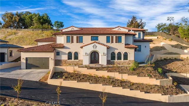 20487 Gartel Dr, Walnut, CA 91789 - mediterranean / spanish house featuring stucco siding, concrete driveway, a tile roof, an attached garage, and stone siding