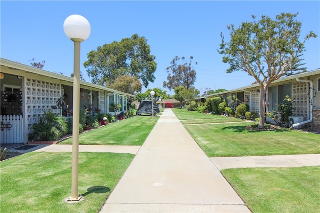 view of home's community featuring a lawn