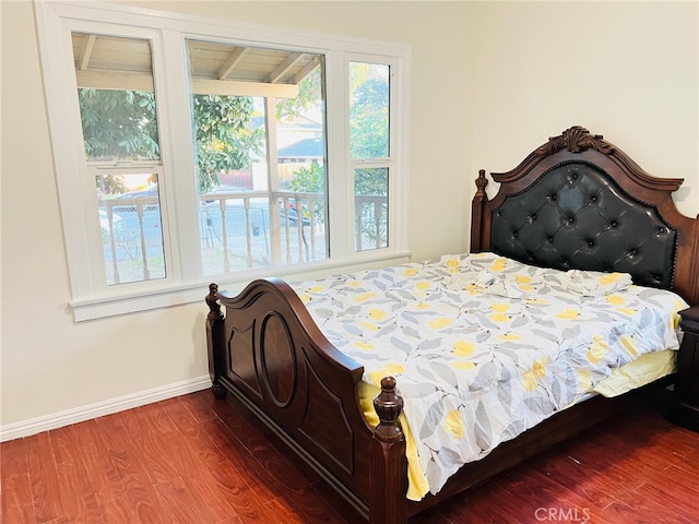 bedroom with hardwood / wood-style floors