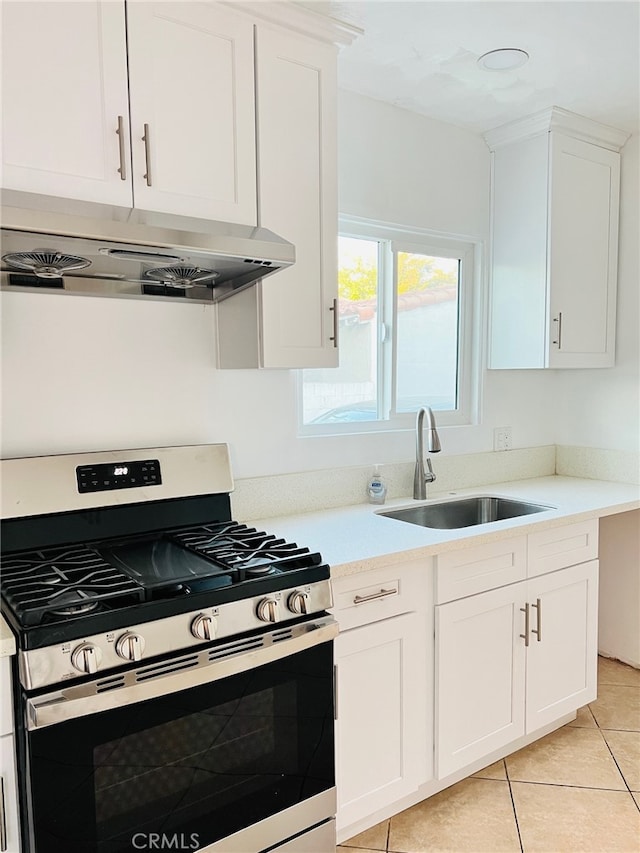 kitchen with white cabinets, sink, and stainless steel range with gas stovetop