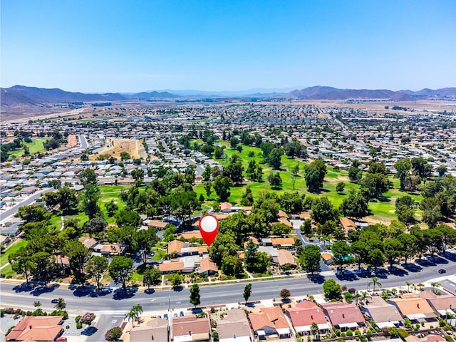 birds eye view of property featuring a mountain view