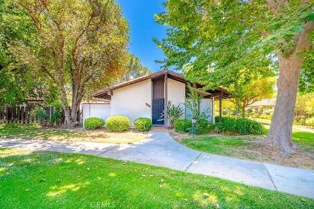 view of front of home with a front lawn