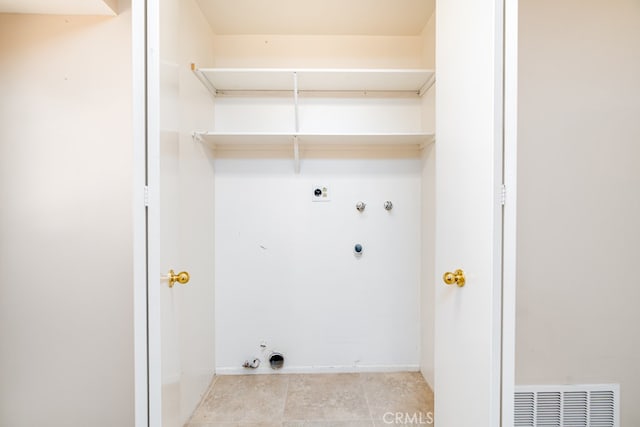 clothes washing area featuring washer hookup, hookup for a gas dryer, and hookup for an electric dryer