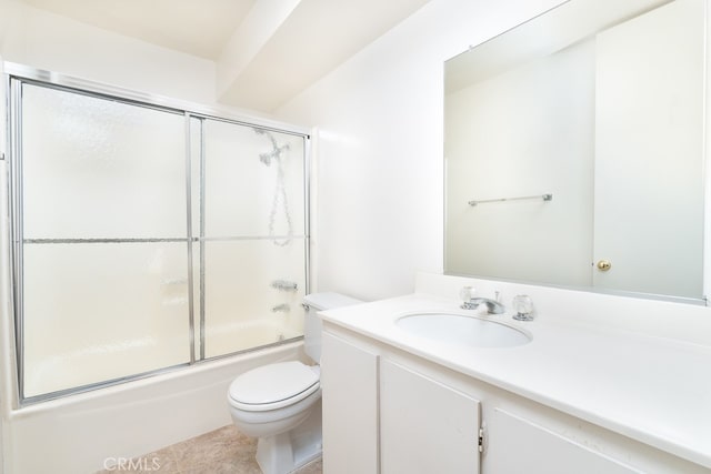 full bathroom featuring tile patterned flooring, vanity, toilet, and bath / shower combo with glass door