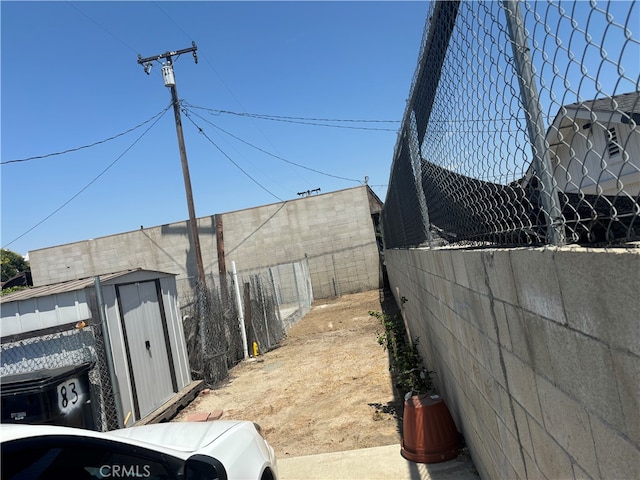 view of home's exterior with a storage shed