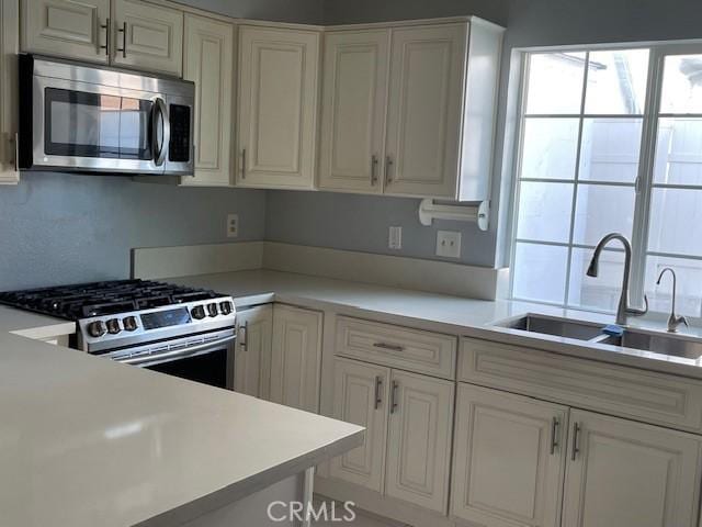 kitchen featuring sink and appliances with stainless steel finishes