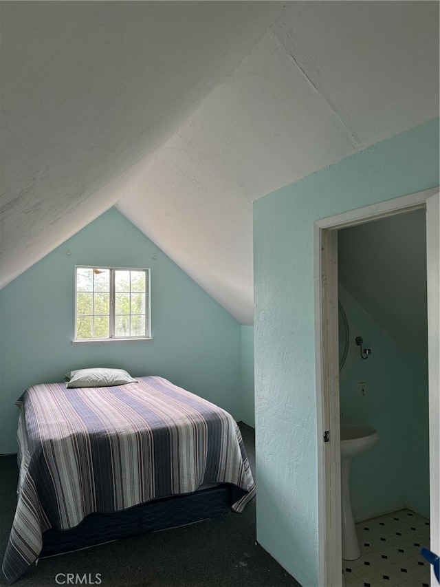 bedroom featuring vaulted ceiling