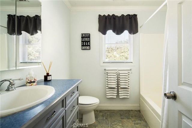 full bathroom featuring toilet, vanity, bathtub / shower combination, and ornamental molding