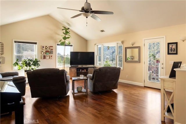 living room featuring ceiling fan, dark wood-type flooring, and lofted ceiling