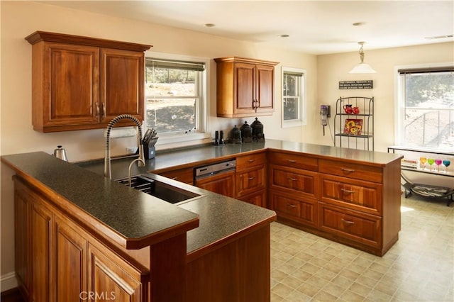 kitchen featuring sink, pendant lighting, and kitchen peninsula