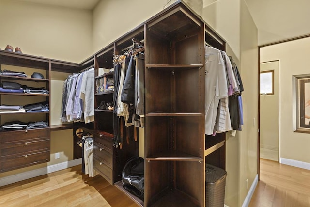 walk in closet featuring light hardwood / wood-style floors