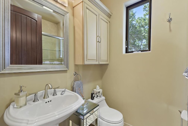 bathroom with sink and toilet