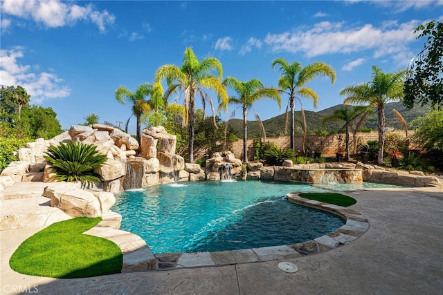 view of swimming pool featuring a mountain view and pool water feature