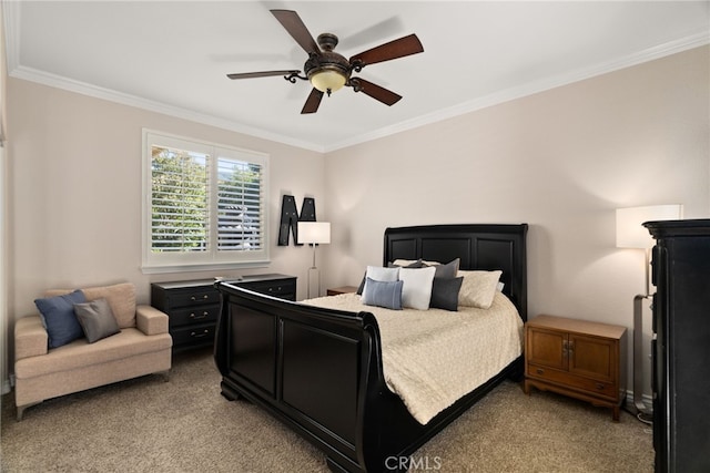 carpeted bedroom with crown molding and ceiling fan