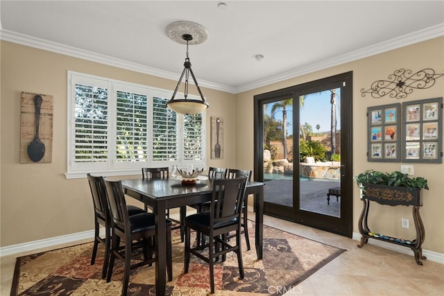 tiled dining space featuring crown molding