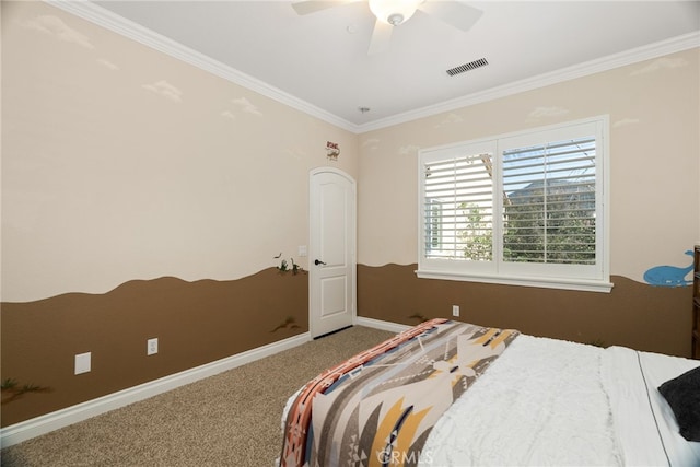 bedroom featuring crown molding, carpet flooring, and ceiling fan